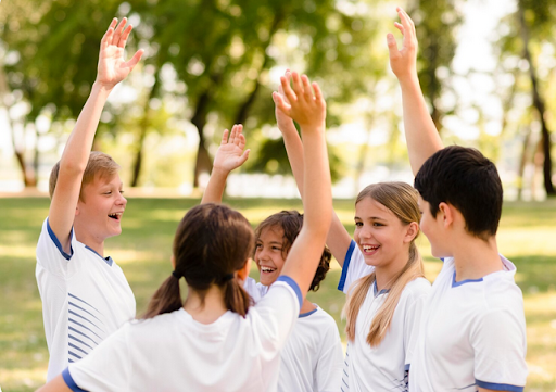 young sports team huddle celebrating outdoors
