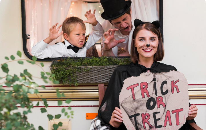 family DIY Halloween costumes with trick-or-treat sign